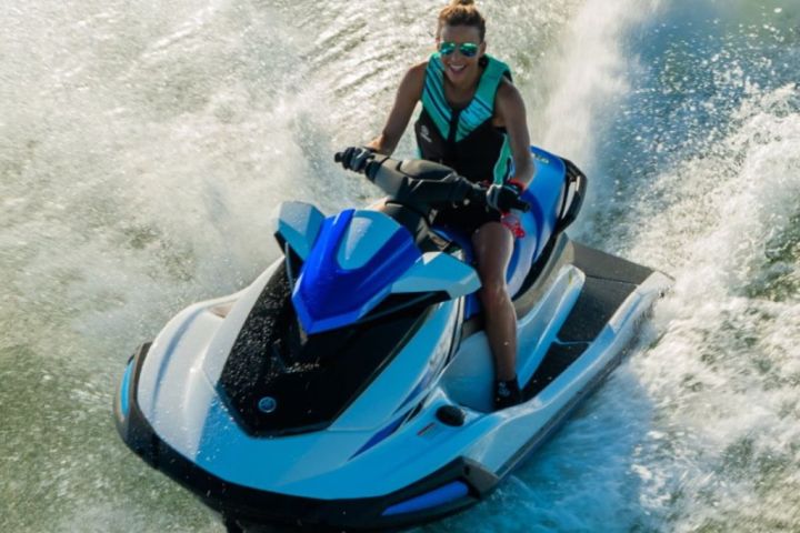 a man riding a wave on top of a body of water