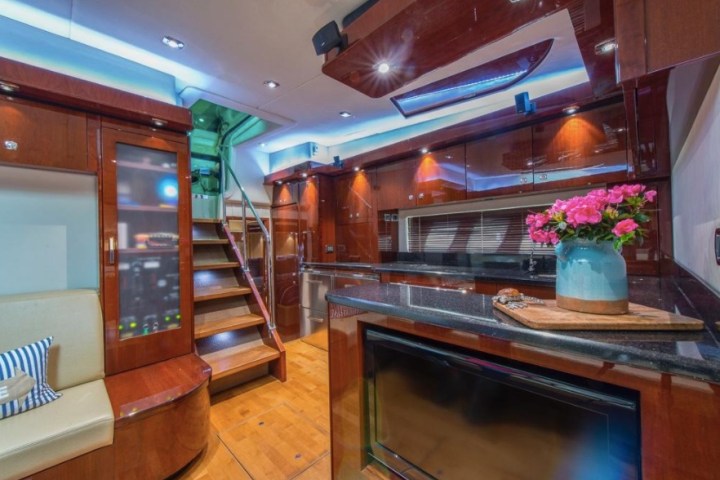 a stove top oven sitting inside of a kitchen